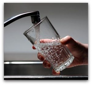 Glass of Water Filling from Tap