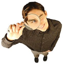 Man Looking Up with Magnifying Glass